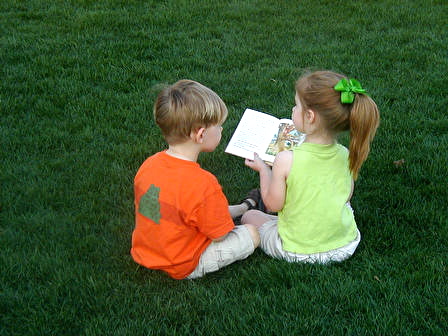 Future homeowners reading a book